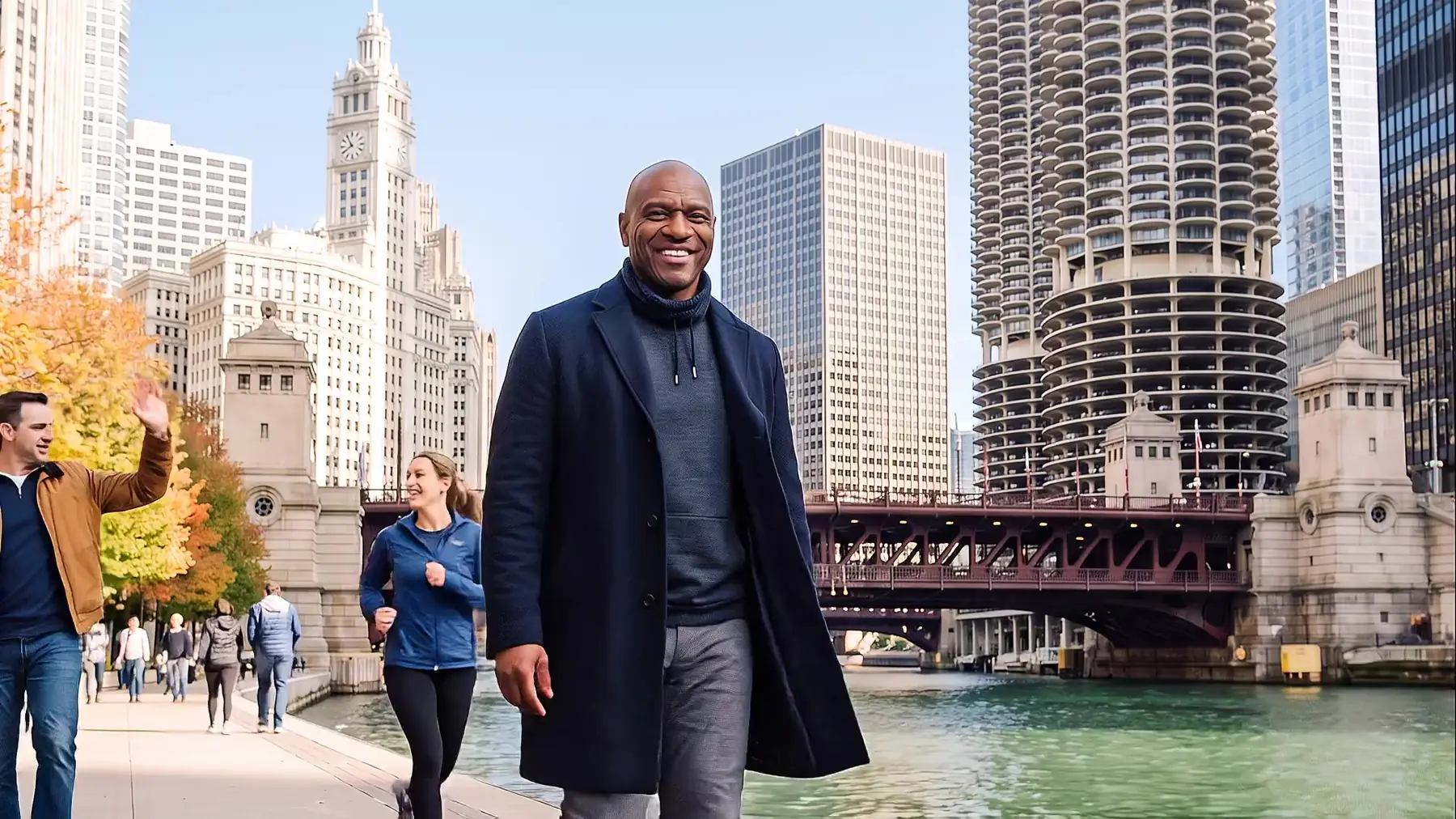 Jarrett Payton walks along the Chicago Riverwalk as passers-by greet him